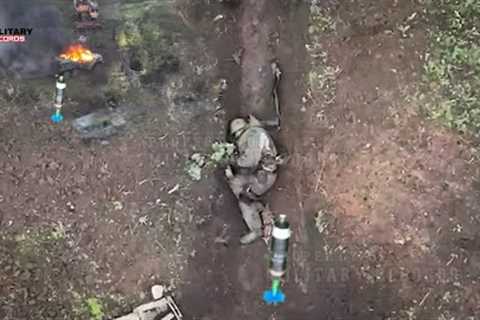 Horrible Footage! Ukrainian drones drop bombs on tens Russian troops hiding in trenches near Bakhmut