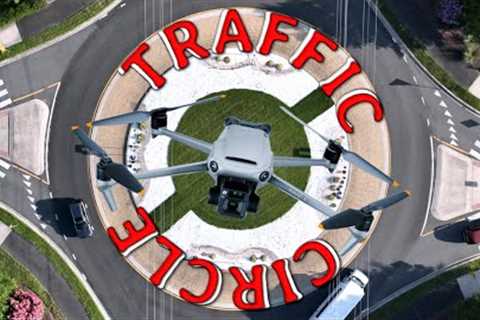 drone rotating with cars in a traffic circle